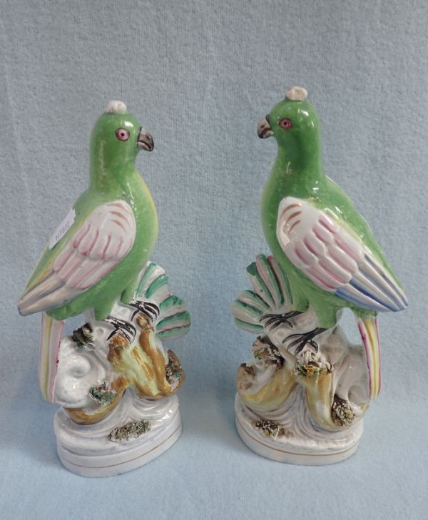 A PAIR OF 19TH CENTURY STAFFORDSHIRE FLAT-BACK PARROTS