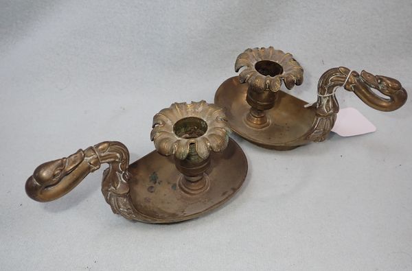 A PAIR OF 19TH CENTURY BRASS CHAMBERSTICKS