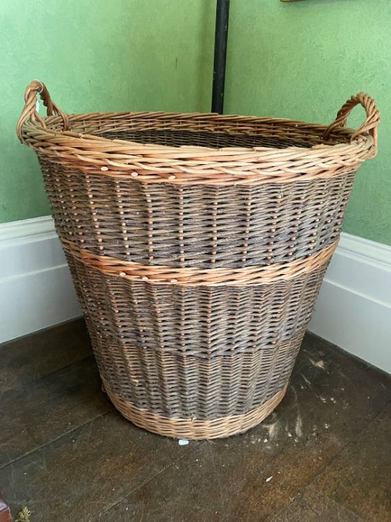 A PAIR OF LARGE WICKER LOG BASKETS,