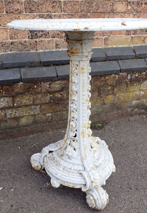 A VICTORIAN CAST IRON GARDEN  TABLE