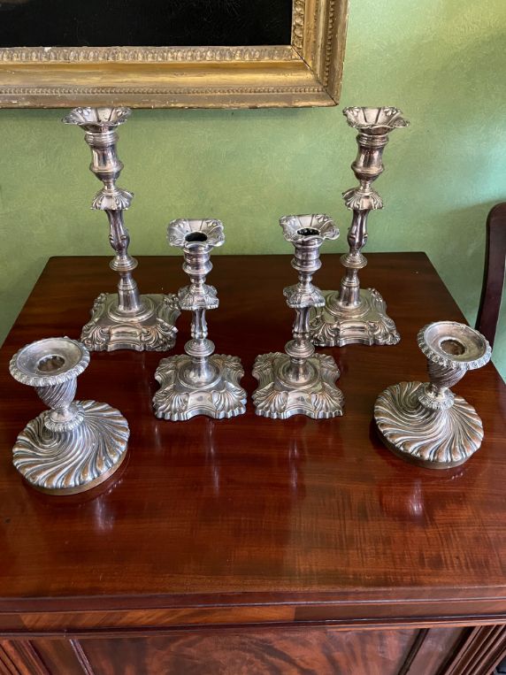 THREE PAIRS OF OLD SHEFFIELD PLATE CANDLESTICKS,
