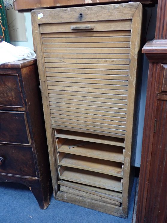 AN EARLY 20TH CENTURY OAK TAMBOUR-FRONT FILING CABINET