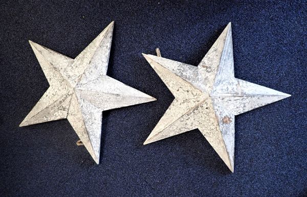 A PAIR OF DECORATIVE WOODEN STARS