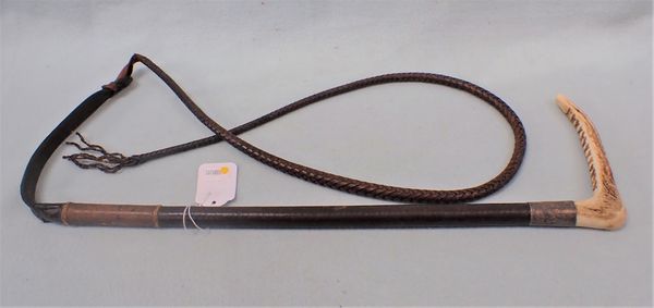 A SILVER MOUNTED HORSE WHIP