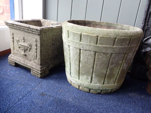 A WEATHERED RECONSTITUTED STONE GARDEN PLANTER