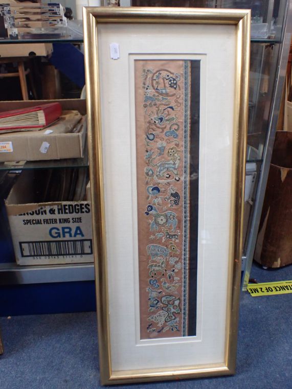 A CHINESE EMBROIDERY FRAGMENT, IN GLAZED FRAME