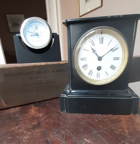 A VICTORIAN POLISHED BLACK SLATE MANTEL TIMEPIECE,