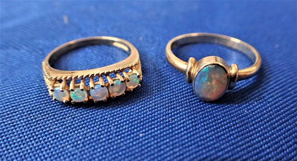 A FIVE STONE OPAL DRESS RING