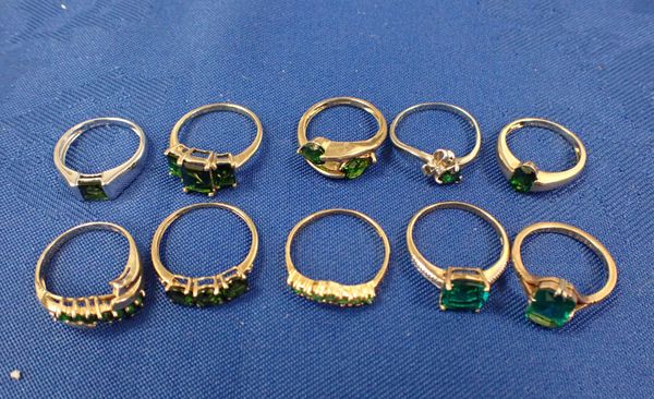 A COLLECTION OF GREEN GEMSTONE RINGS