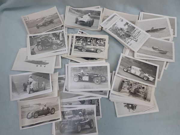 A COLLECTION OF BLACK & WHITE PHOTOGRAPHS OF RACING CARS