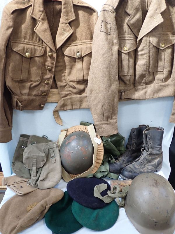 A WWII HELMET IN CANVAS AND WEBBING CARRIER