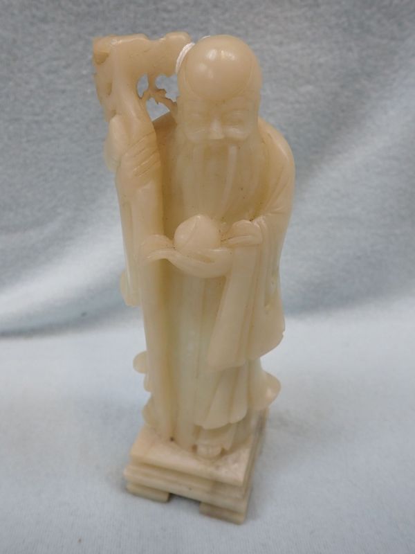 A CARVED SOAPSTONE STUDY OF A WISE MAN