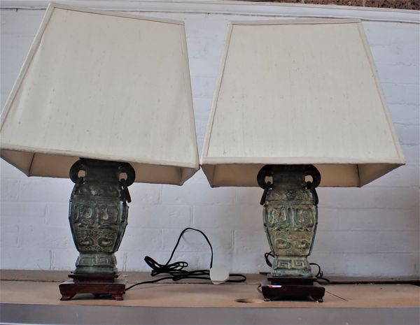 A PAIR OF CHINESE RELIEF BRONZE VASE TABLE LAMPS