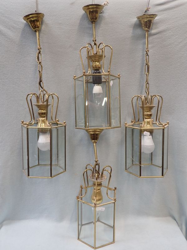 FOUR BRASS-FRAMED HEXAGONAL HALL LANTERNS