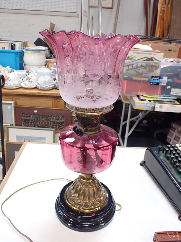 A VICTORIAN OIL LAMP WITH ORIGINAL ETCHED CRANBERRY SHADE