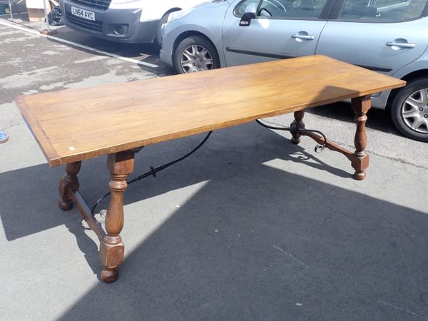 A LARGE SPANISH ELM TABLE