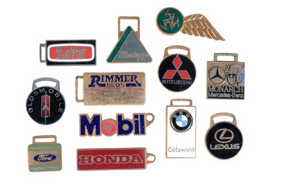A COLLECTION OF ENAMELLED CLASSIC VEHICLE KEY FOBS