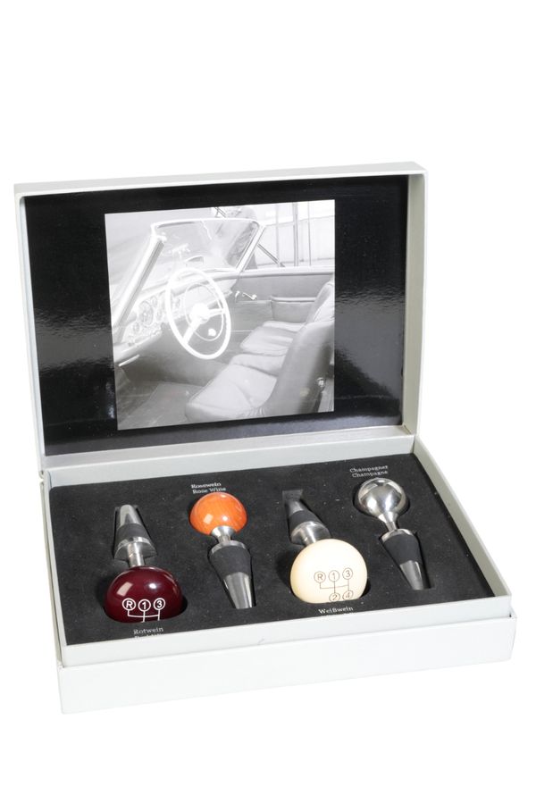 A CASED SET OF MERCEDES BENZ WINE STOPPERS