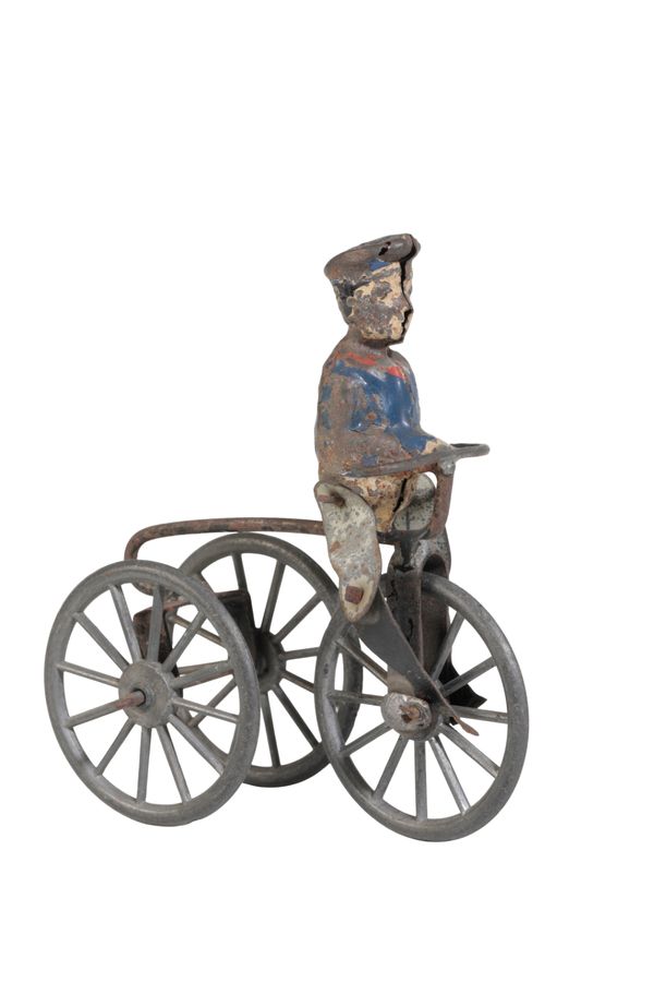 A c.1900 TOY TRICYCLE WITH TINPLATE RIDER