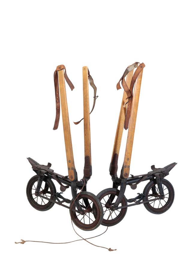 A PAIR OF 1920'S TWO WHEELED SKATES