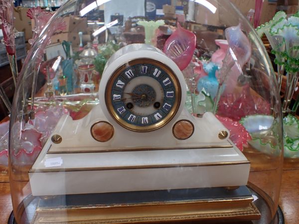 A DOMED FRENCH ALABASTER STRIKING CLOCK