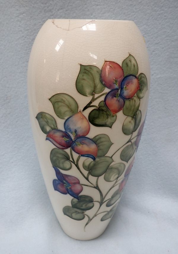 A MOORCROFT VASE, DECORATED WITH FLOWERS