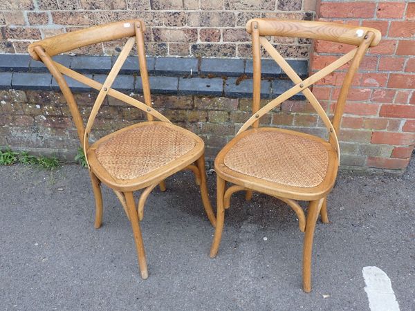 A PAIR OF 'OKA' CONTINENTAL STYLE LIGHT OAK 'CAFE' CHAIRS
