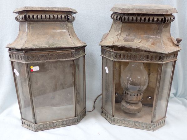 A PAIR OF BRASS FRAMED WALL LANTERNS