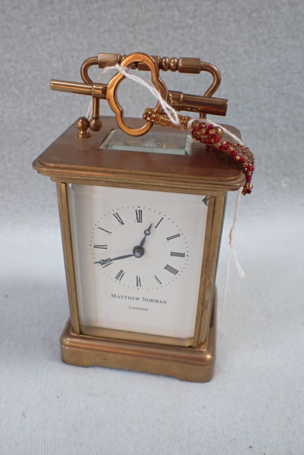 A BRASS CASED CARRIAGE CLOCK