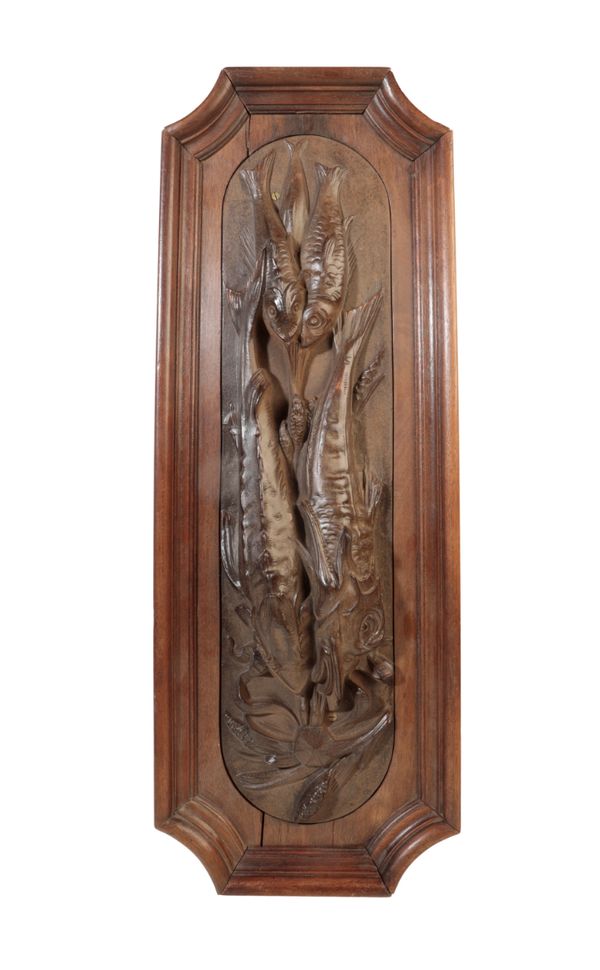 A CONTINENTAL CAST IRON WALL MOUNTING RELIEF OF A BRACE OF STURGEON,