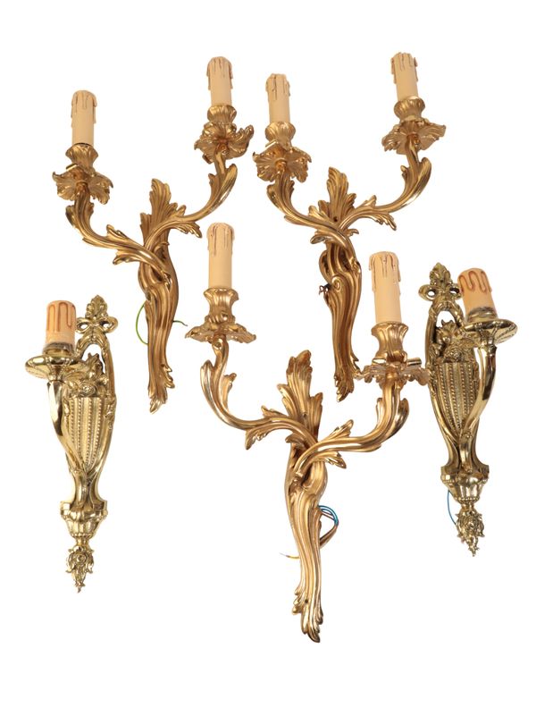 A SET OF THREE GILT METAL TWIN LIGHT WALL APPLIQUES IN LOUIS XV STYLE,