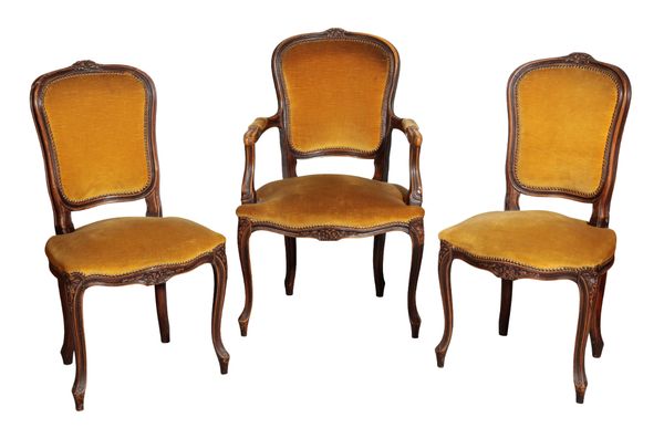 A SET OF EIGHT CARVED WOOD DINING CHAIRS IN LOUIS XV TASTE,