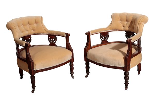 A PAIR OF VICTORIAN CARVED WALNUT AND BUTTON UPHOLSTERED TUB CHAIRS,
