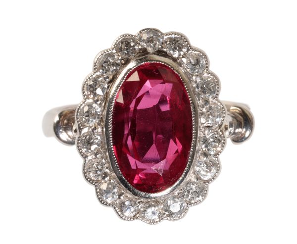 A SYNTHETIC RUBY AND DIAMOND CLUSTER RING