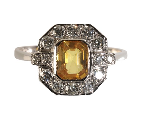 AN ART DECO YELLOW SAPPHIRE AND DIAMOND CLUSTER RING