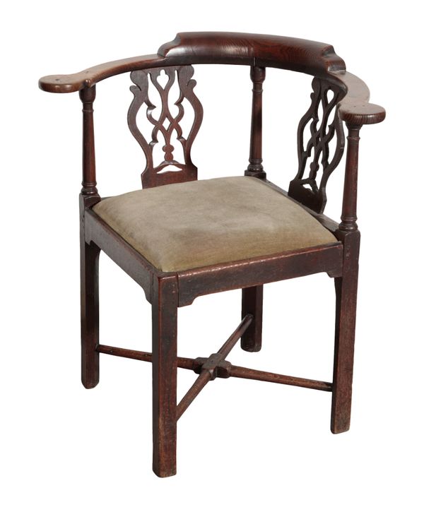 A GEORGE III 'COUNTRY CHIPPENDALE' OAK CORNER ELBOW CHAIR,