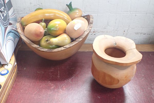 A TURNED WOODEN BOWL CONTAINING WOODEN FRUIT