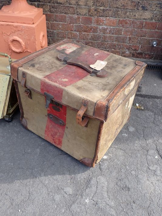 A VICTORIAN CANVAS AND LEATHER TRIMMED TRUNK