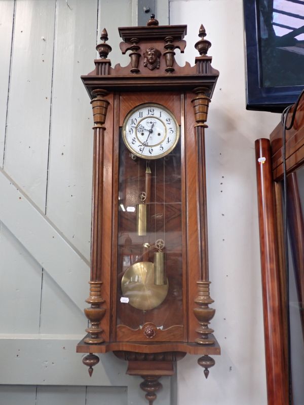 A  WALNUT CASED VIENNA  WALL CLOCK