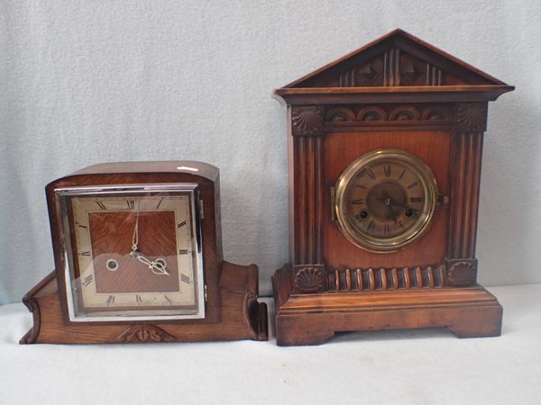 A WALNUT-CASED MANTEL CLOCK