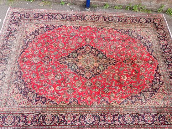 A LARGE PERSIAN DESIGN RUG