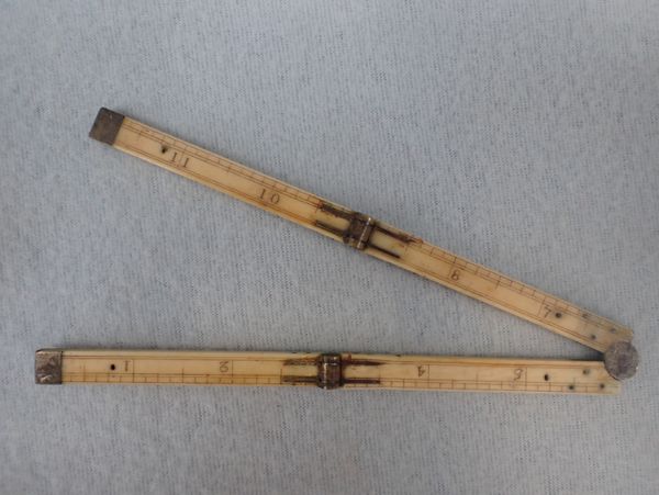 A 19TH CENTURY IVORY AND BRASS  FOLDING RULE