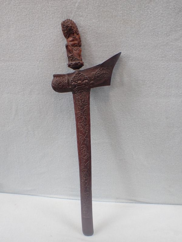 A KRIS, WITH PROFUSELY CARVED SCABBARD AND GRIP