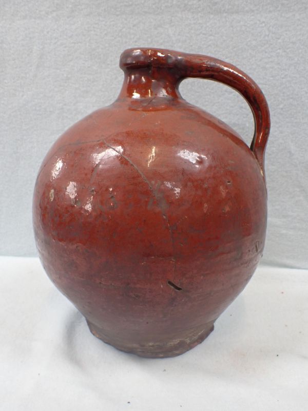 A GLAZED EARTHENWARE FLAGON