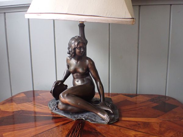 A BRONZED SPELTER FIGURAL LAMP