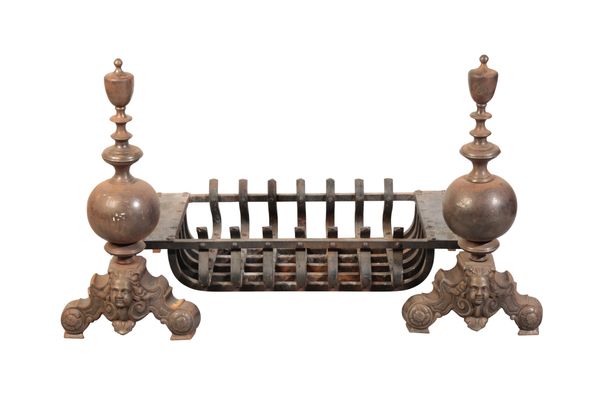 A CAST AND WROUGHT IRON DOG GRATE IN EARLY 17TH CENTURY STYLE,