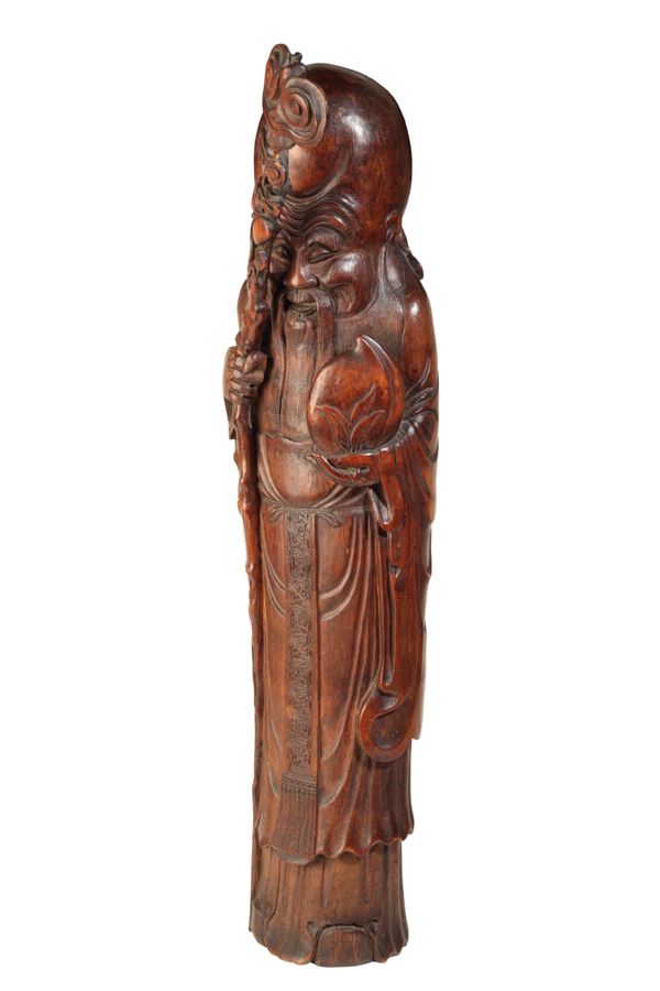 LARGE CARVED FIGURE OF SHOU LAO, QING DYNASTY, 19TH CENTURY
