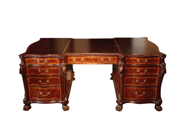 A MAHOGANY AND CROSSBANDED PARTNERS DESK IN KENTIAN STYLE AND IN THE MANNER OF GILLOWS,