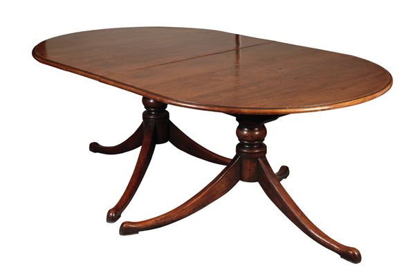 A TWO-PEDESTAL OAK DINING TABLE