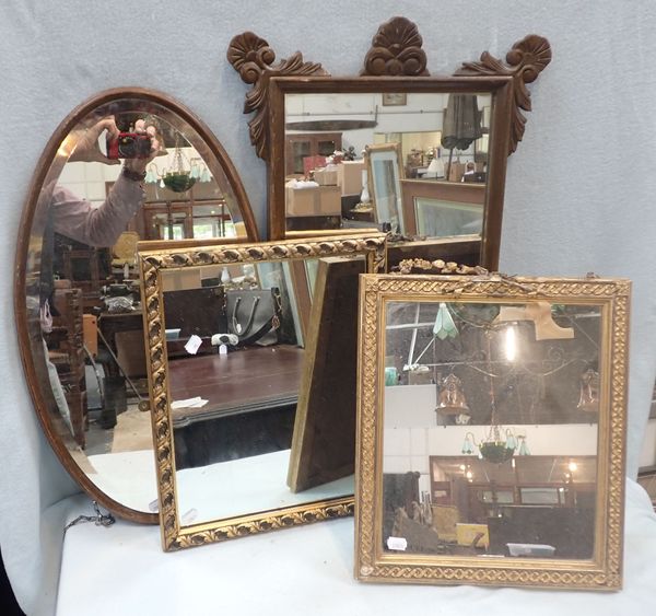 A WALL MIRROR WITH CARVED DECORATION